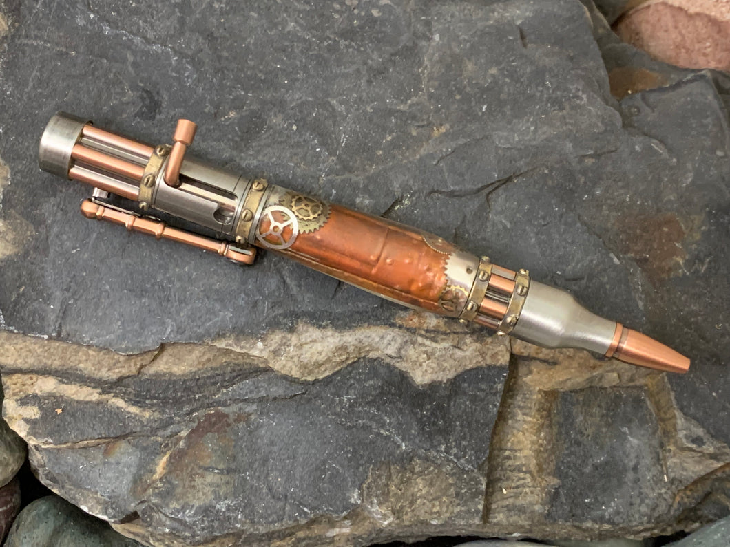 Handmade Steampunk Bolt Action & Gears Pen. Beautifully detailed pen with a fire painted copper background which was then embossed and hand sculpted.  Encircling the copper is a variety of metal gears which was then encased for comfort and protection.